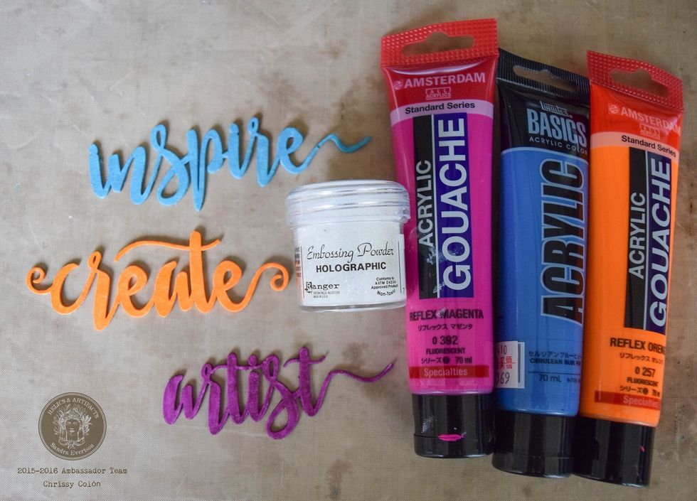 Paint chipboard words with acrylic paint. Once dry, heat set holographic embossing powder