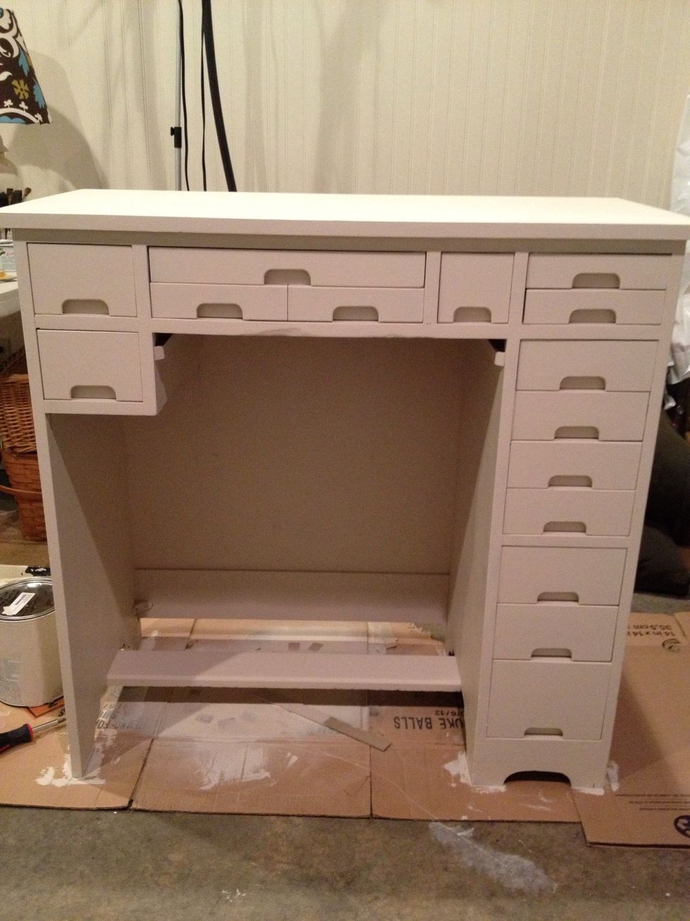 Paint drawers separately, do not paint sides or slider areas of the drawers, as that just makes them stick. use wax to help old drawers slide better. Just apply an old candle along sliding area.
