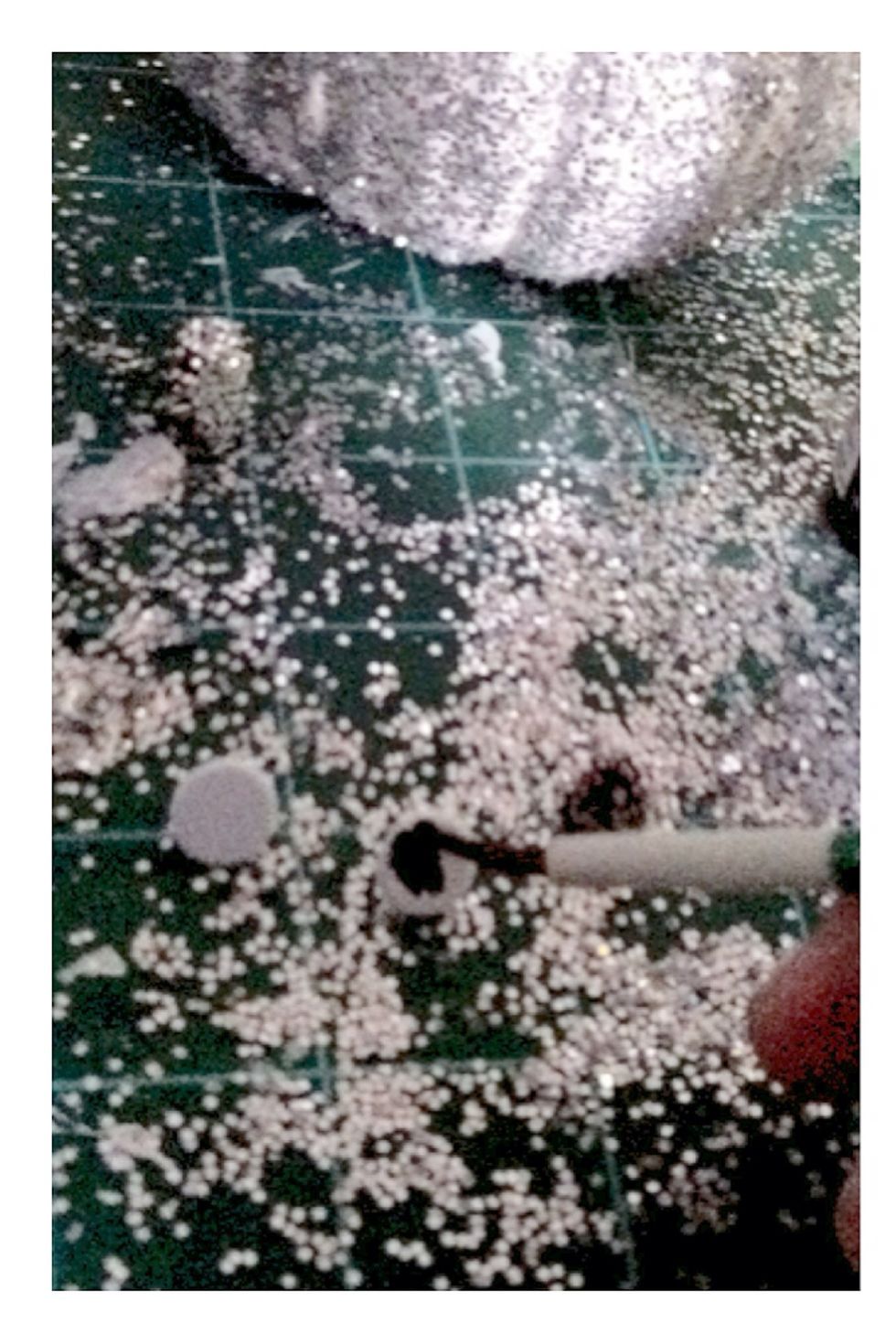 Paint each push pin black. While still wet, dip the pin in glitter and let dry.