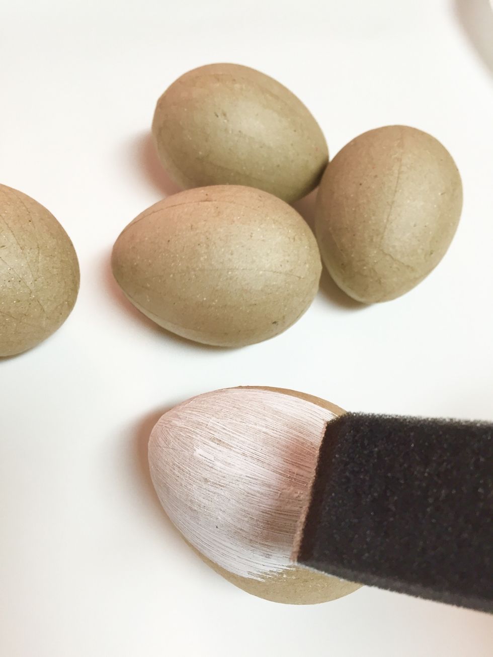 paint eggs with 2 coats of white acrylic paint; allowing eggs to dry between coats. the white color will allow the Izink Inks to shine brighter!