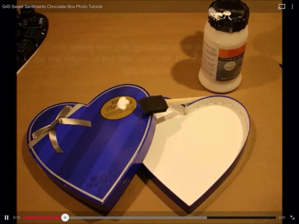 Paint entire box in gesso or white paint. Paying close attention to edges. Even though most will be covered with paper the paint makes the slick surface easier to glue to