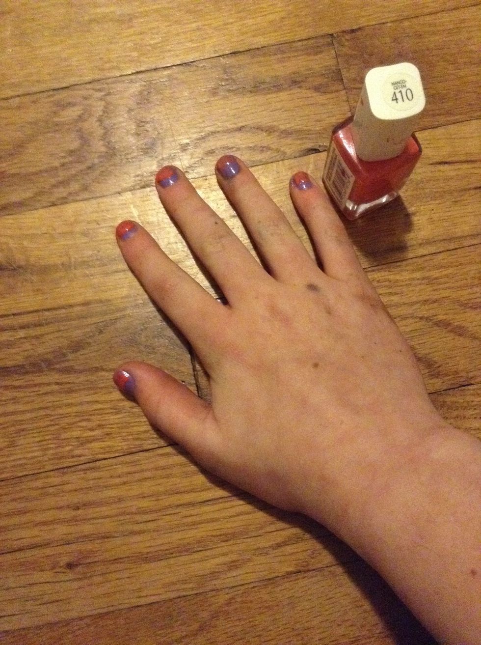 Paint every nail from the middle up with your second regular nail polish. I used L'Or\u00e9al Paris #410 Mango-Get-Em.