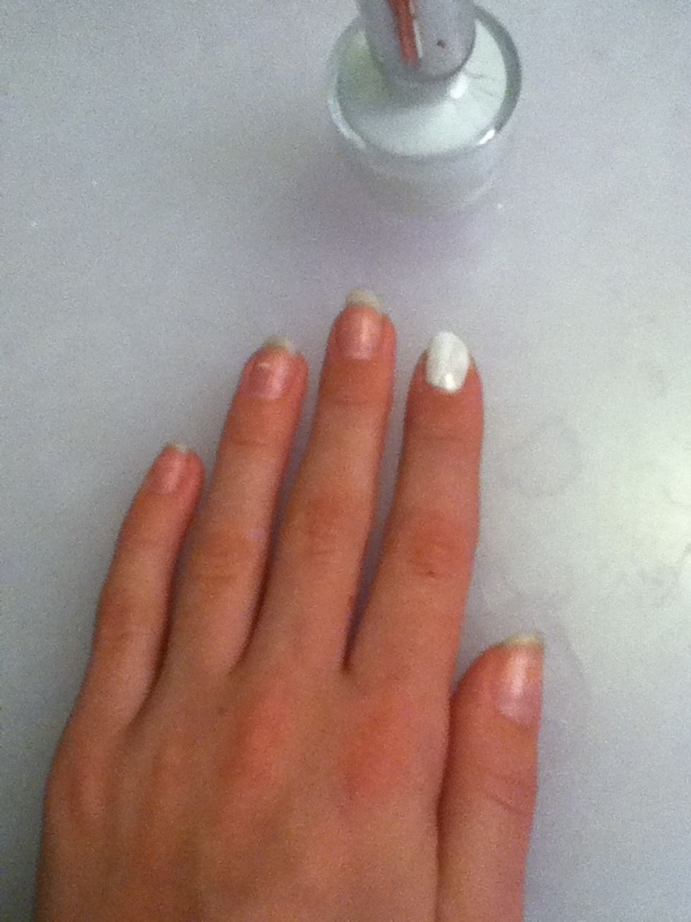 Paint first nail fully white wait for it to dry.