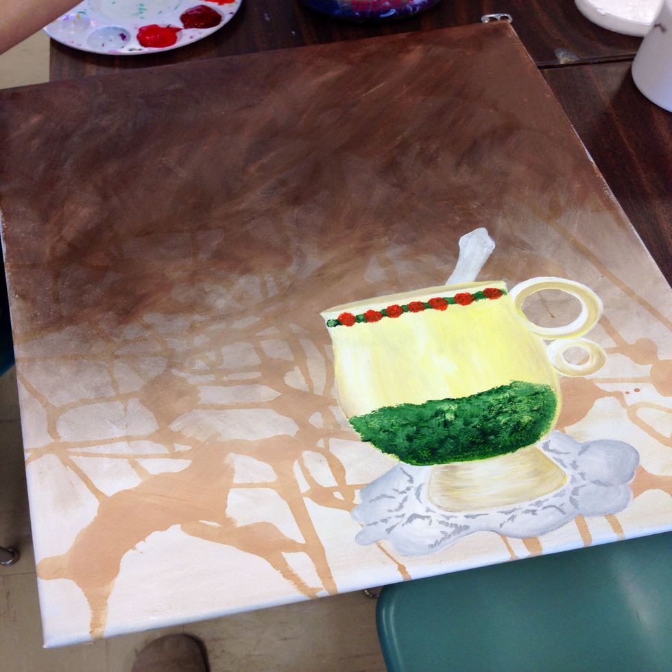 Paint flowers over the green paint and allow them to dry.  Also paint the spoon grey.  Stipple dark grey on the doily in a pattern in order for it to look like lace.  Paint the spoon and allow to dry.