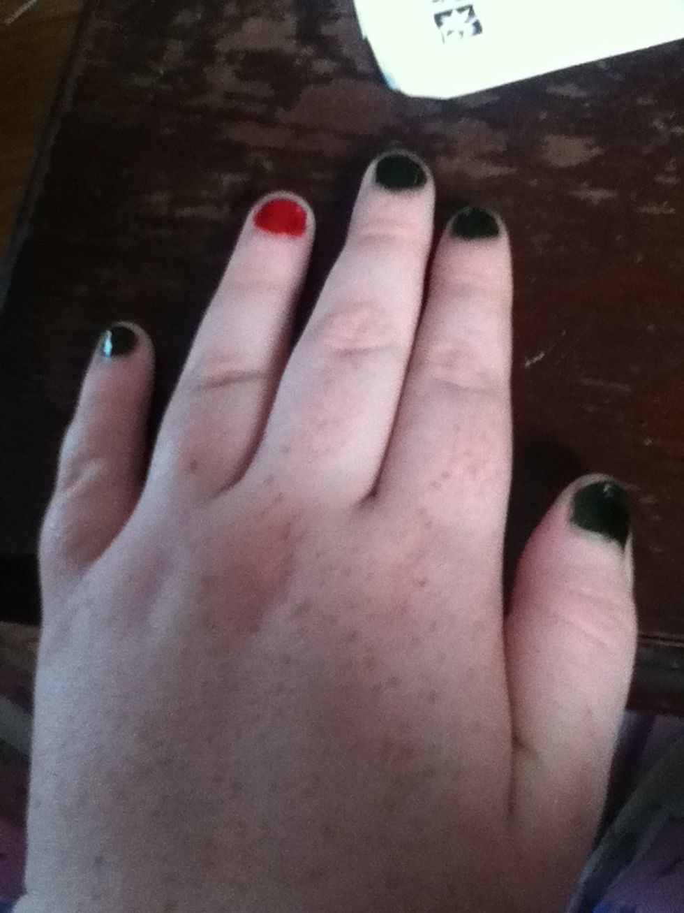 paint four of your nails green and one nail red. it doesnt matter which nail is red. you can use different colors, but if you have a light color make sure you do two coats of it.