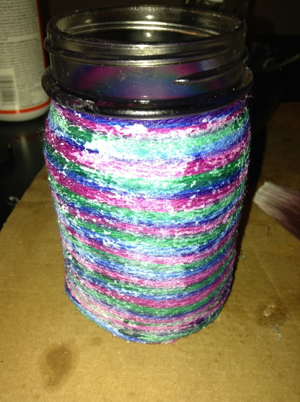 Paint glossy glue over yarn