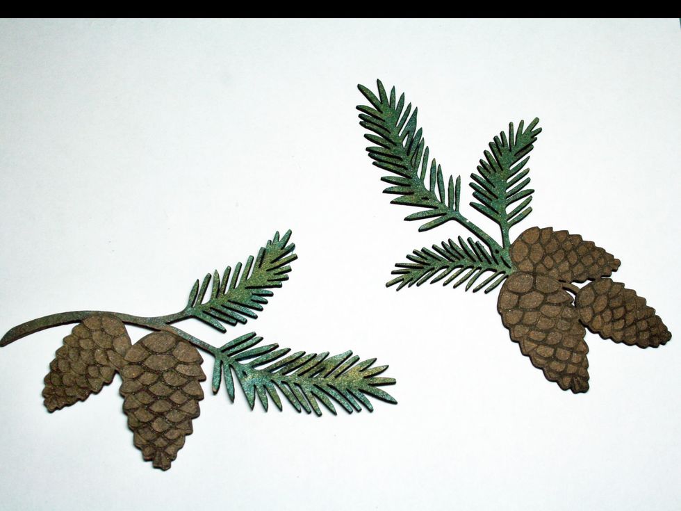 Paint on mist.  First I used Lindy's Frost Forest Green.  After that dried, I dabbed on some Ponderosa Pines Olive.  (Note, I used dabber caps on alot of my mists for these kinds of applications.)
