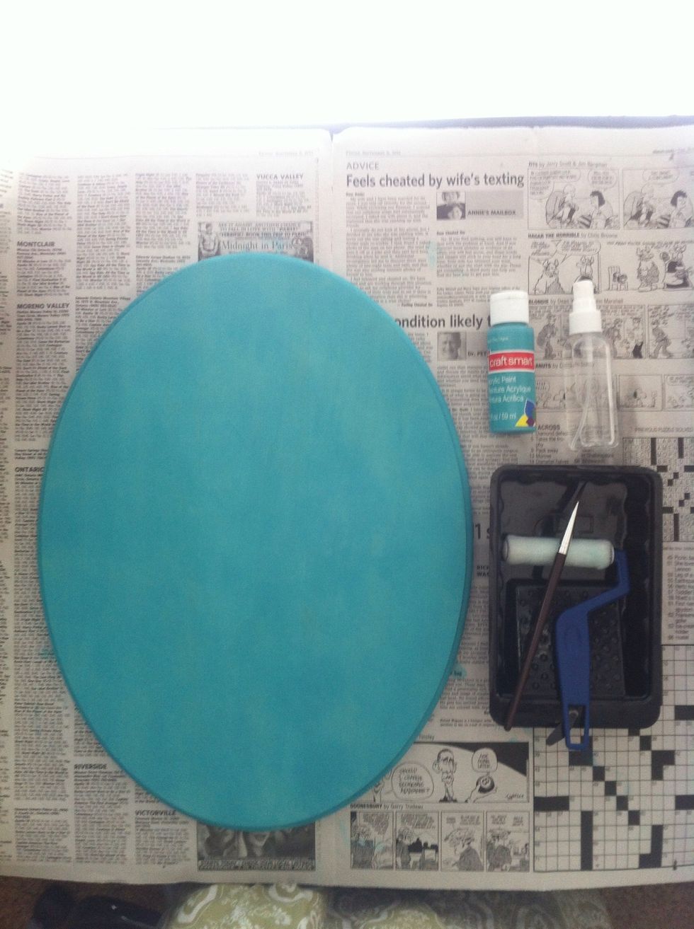 Paint or stain your board however you like. Here I used an aqua craft paint on unprimed wood with a little water to get more of a stained rustic look.