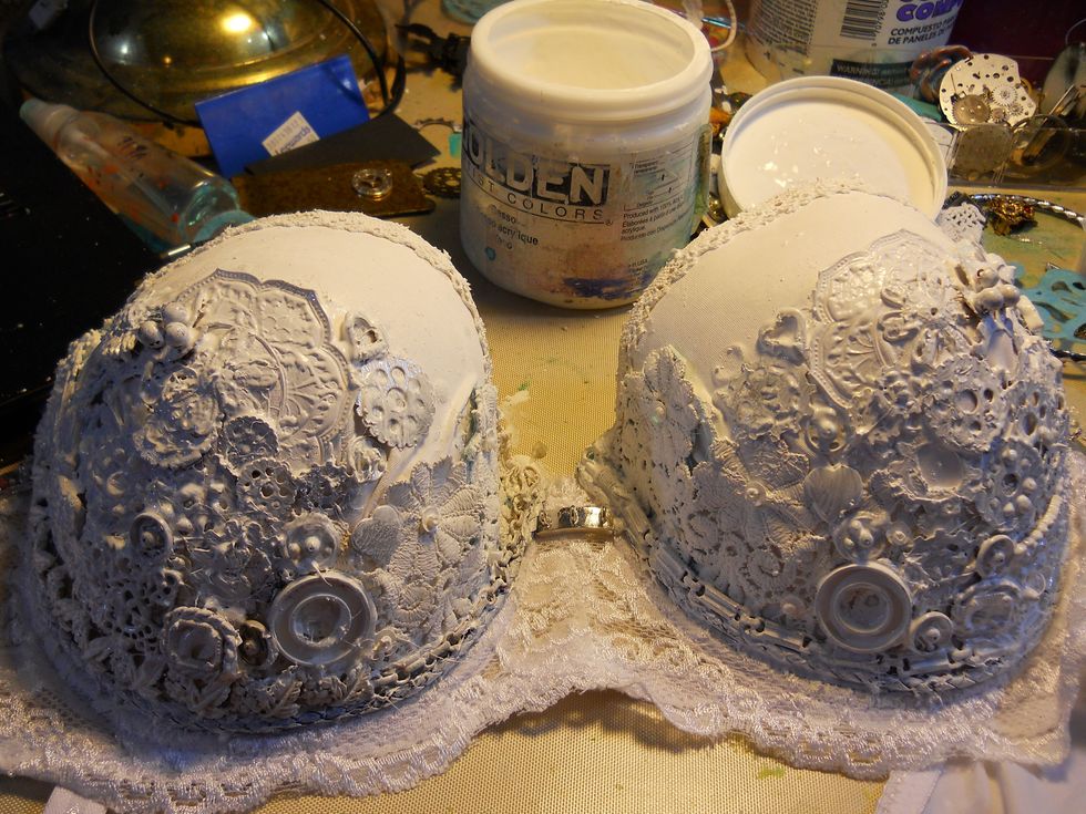 Paint over the entire thing with Gesso and all to dry completely.