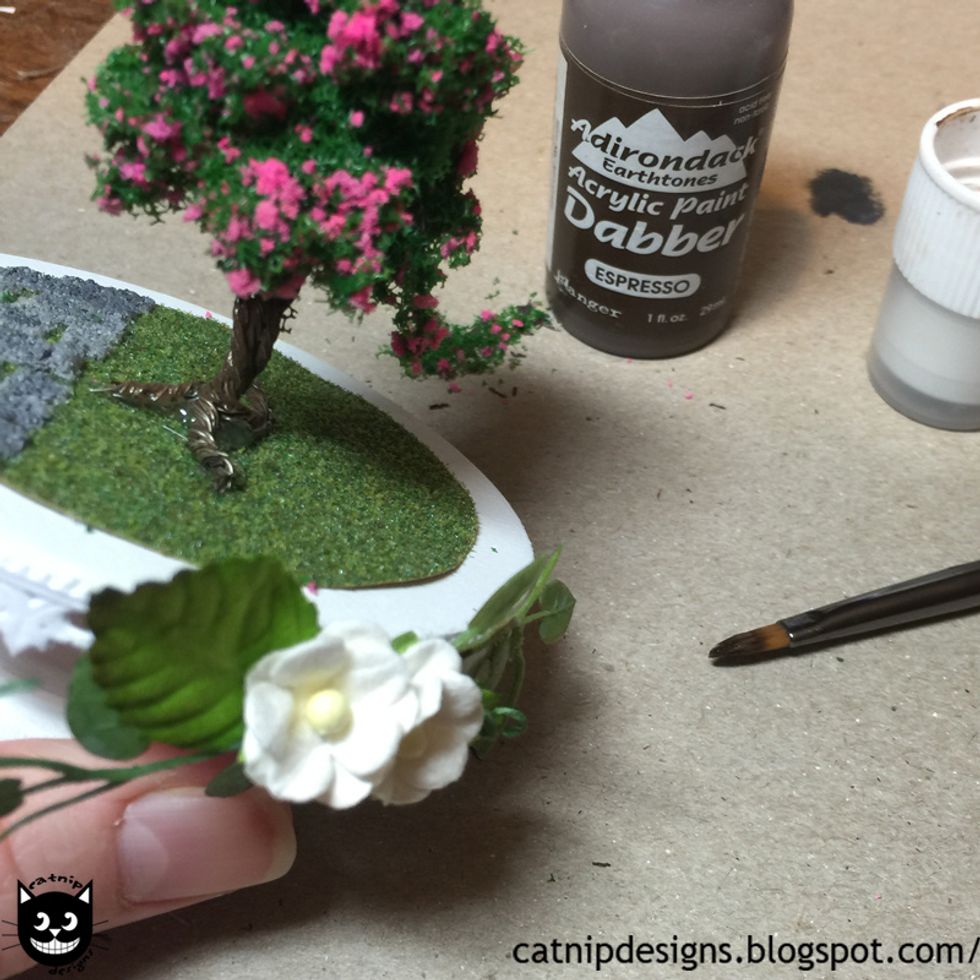 Paint over the roots on your Tiny Tree with Pink Blossoms where the paint has chipped off from twisting the wire into roots.