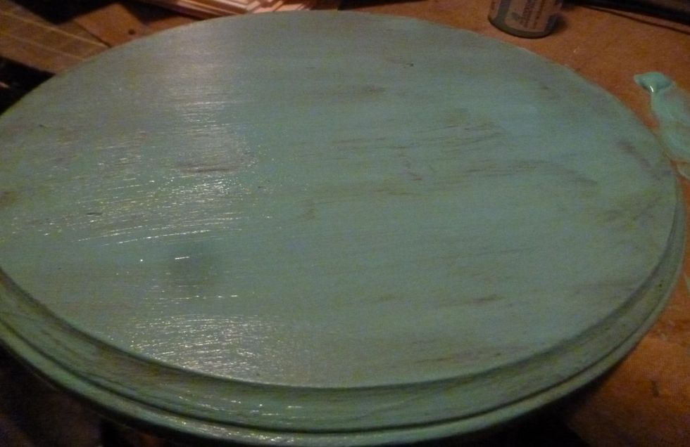 Paint over the wax with your lighter color. You can see the areas where the paint doesn't stick to the wax. I used Folk Art patina acrylic paint. Let dry completely.