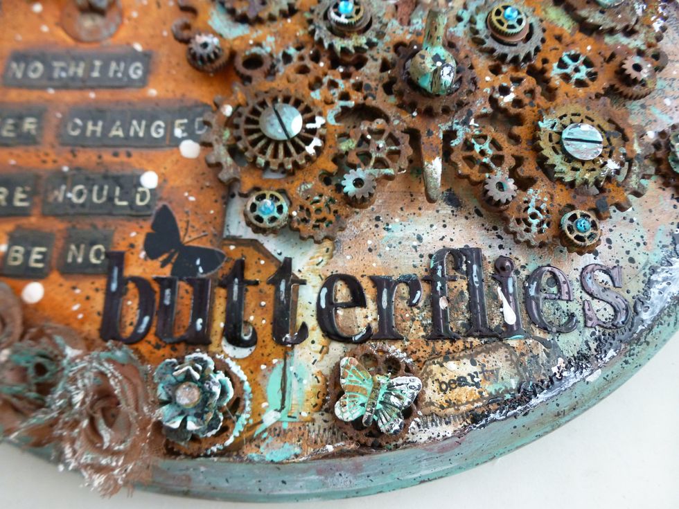 Paint TH industrial stickers (silver) with black alcohol ink. I did direct to sheet without using pad to get intense color. Highlight letters with Uniball Signo white gel pen.