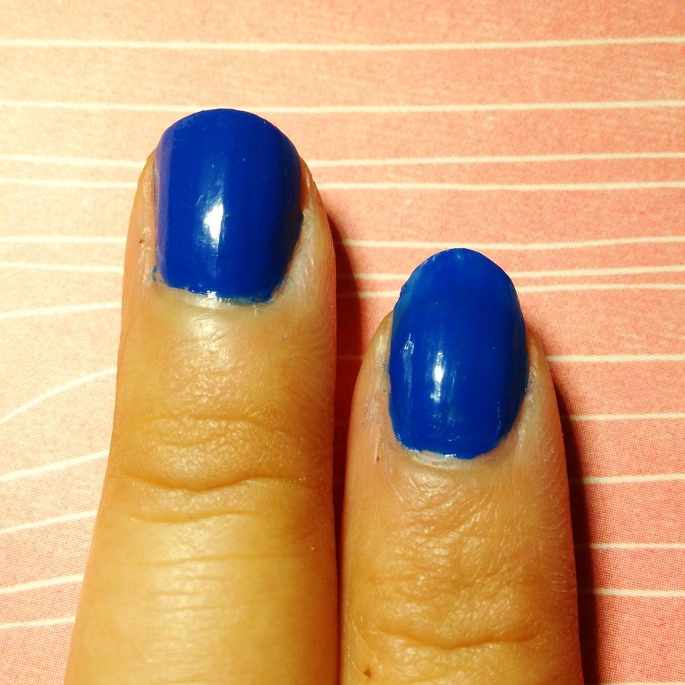 Paint the base of your nails blue.