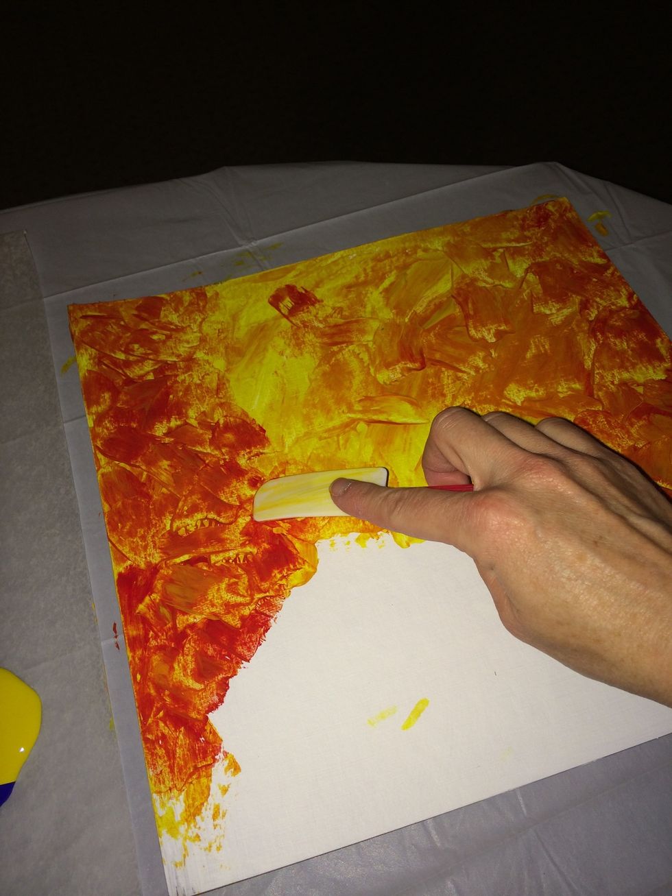 Paint the base using small short dabs. Start with yellow over the top 2/3rds of your base. Lightest colors MUST be placed first.