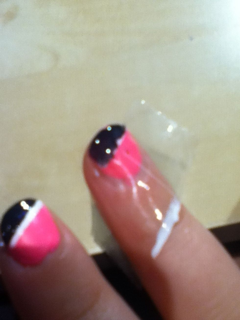 Paint the black on in the same way as the white you may find the white looks like its shining through just go over it a little more and get a solid black