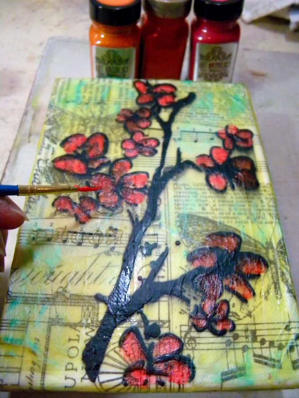 Paint the blossoms with a mixture of Coral and Mi Bella Sorbet and Tango Velvet. I used a small brush and spread it thin to see the layers underneath. For deeper color, add a few layers of color.