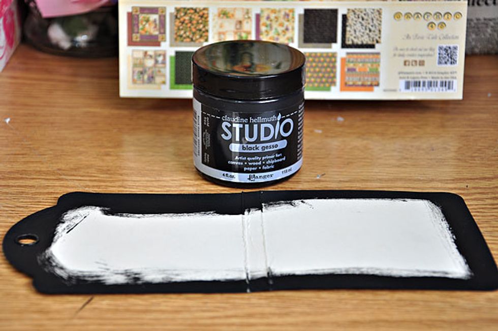 Paint the edges of the ivory tag with black gesso. Score the tag at 4 and 4.35