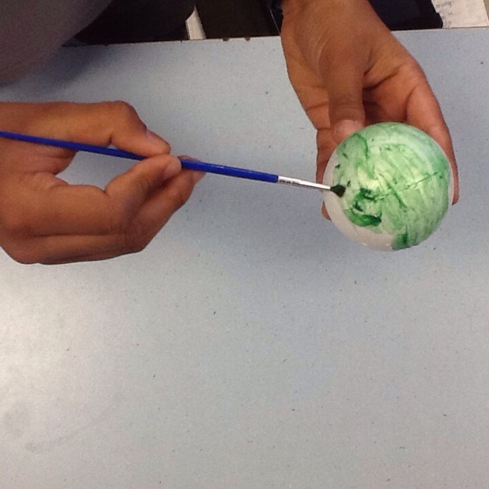 Paint the foam ball green.