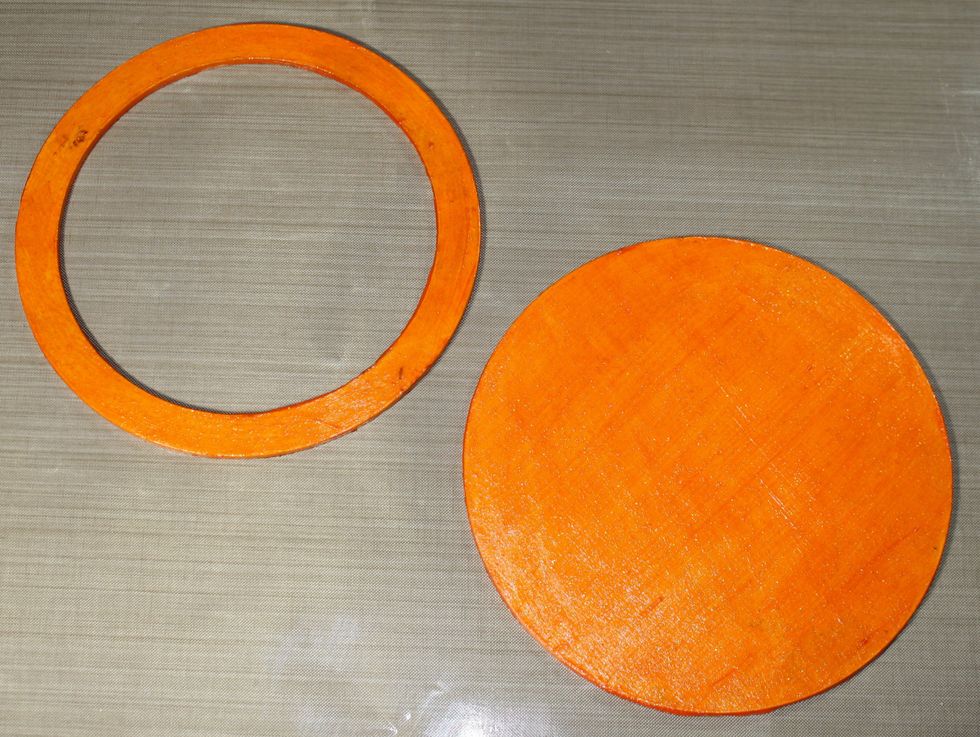 Paint the front and back of each circle frame