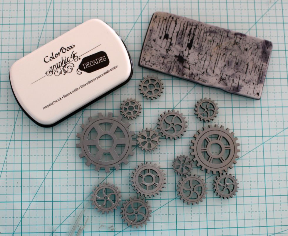 Paint the gears in Grey color and we are going to Stamp it! I used the Graphic 45 Color Box Ink.. It is fabulous!!!!