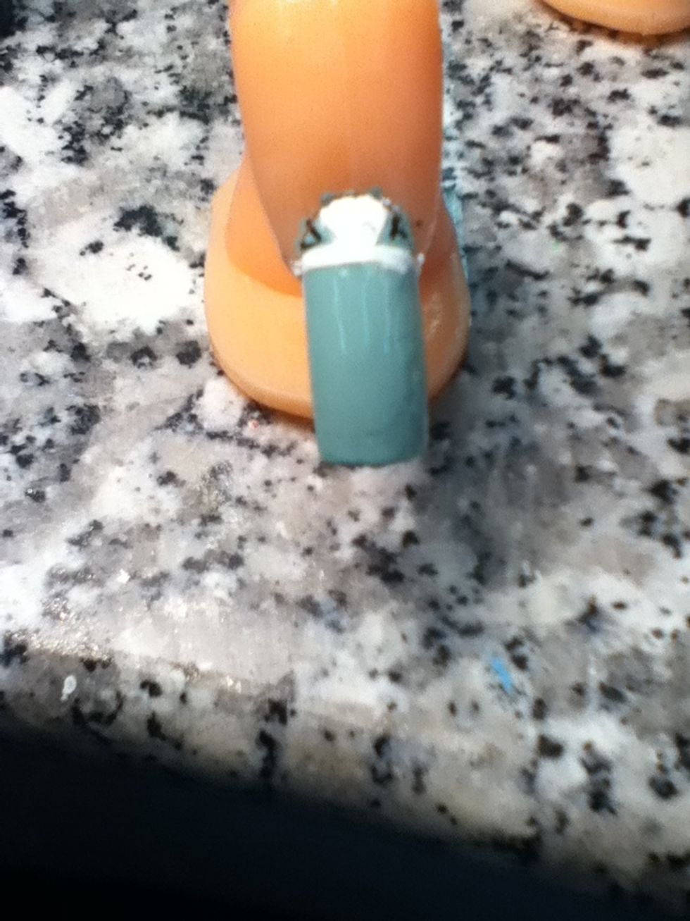 Paint the inside of the v all white and then make little v's on the side of the nail.