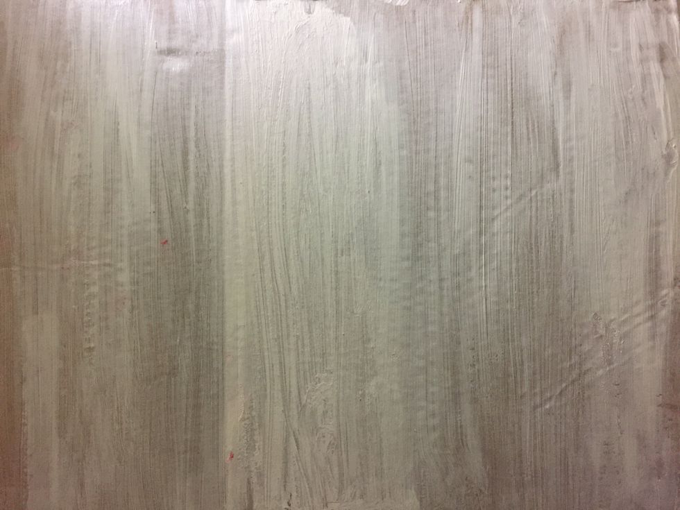 Paint the largest pieces of cardboard white.