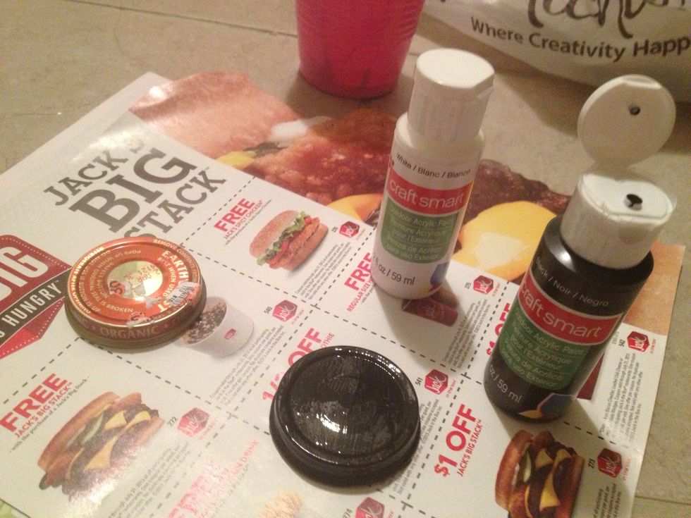 Paint the lids w/ acrylic paint. The original idea used chalkboard paint, which you can now get in the same craft section. Chalkboard isn't my flavor, so went with this.