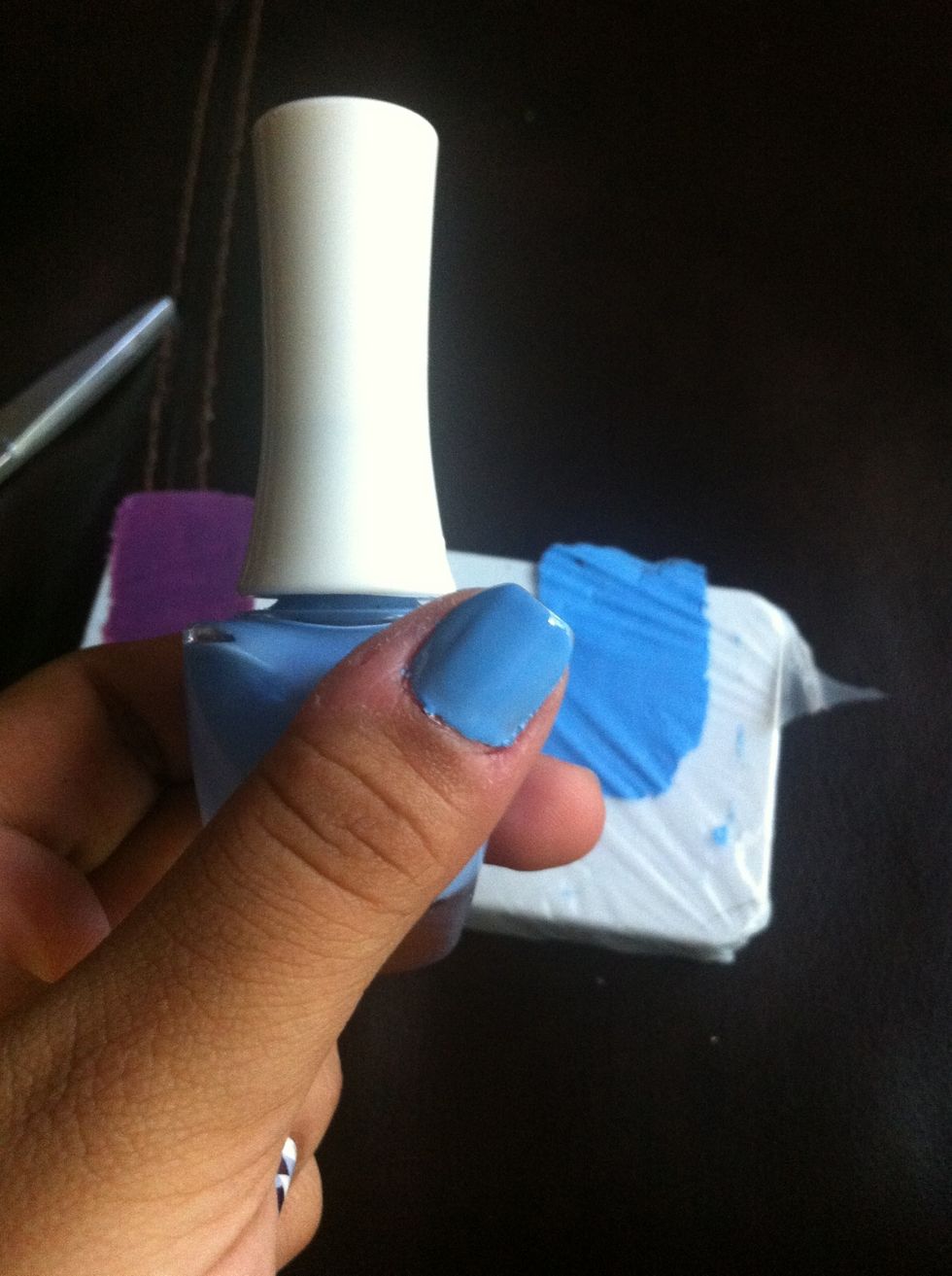 Paint the nail of your choice with a base color (one of the three colors that you have already chosen)