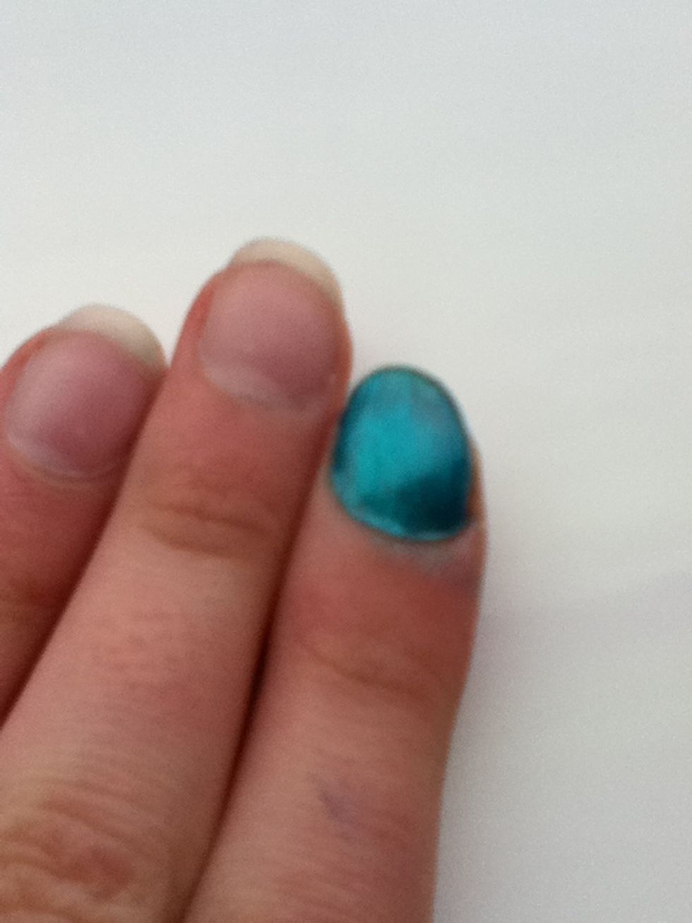 Paint the nail with the turquoise polish and leave to dry.