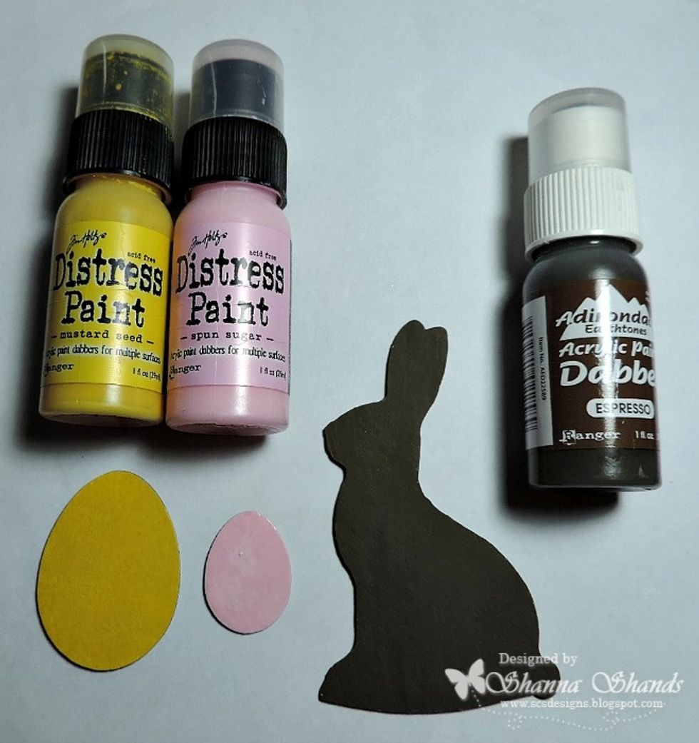 Paint the pieces the colors you want. I went for a chocolate bunny and bright colored eggs.
