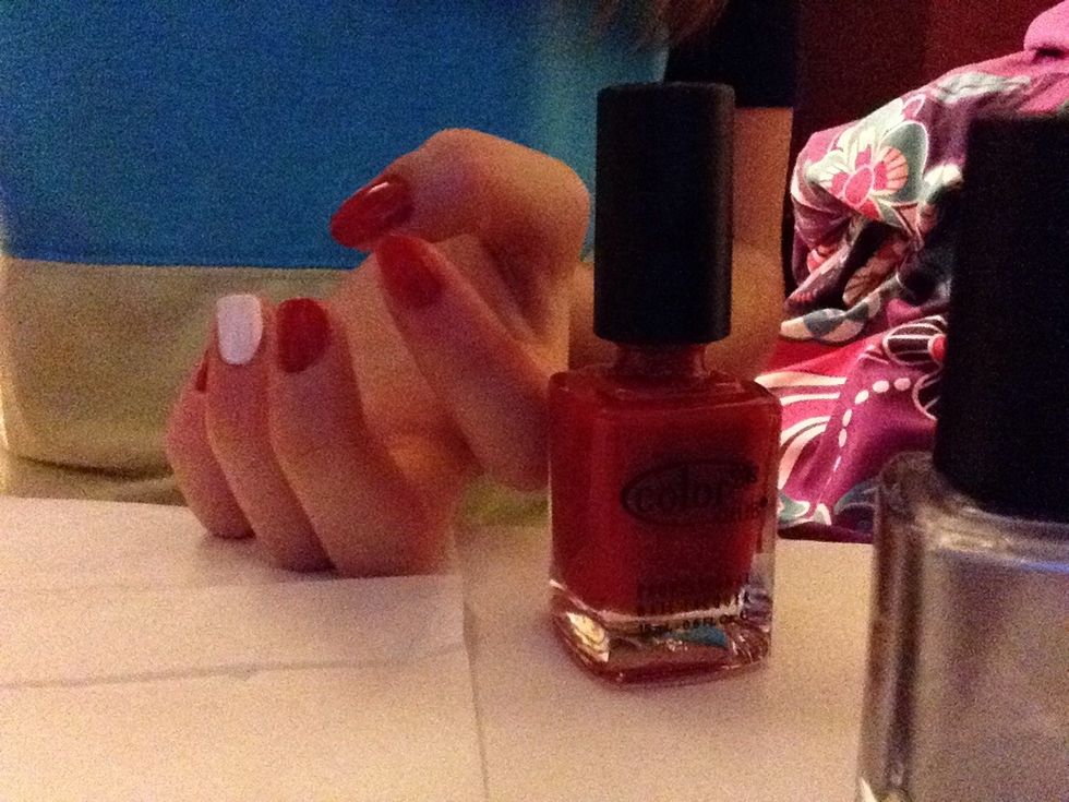 Paint the rest of your fingers red. A tip is to use a toothpick to clean up excess nail polish after painting so you can get in the cudicles.