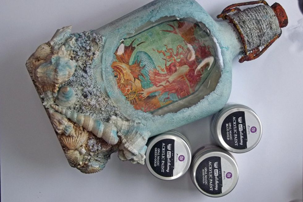 Paint the shells with Opal Magic Acrylic Paints. I've also sponged a little brown rust paste on the sand/stones and then sponged with more white gesso.