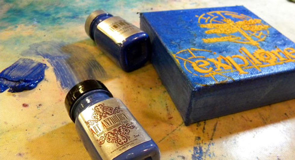 Paint the sides of the canvas with Reef Velvet and Honolulu Blue Sorbet. When this dries, paint a coat of Blue Topaz Gemstones to give it a gemlike shimmer.