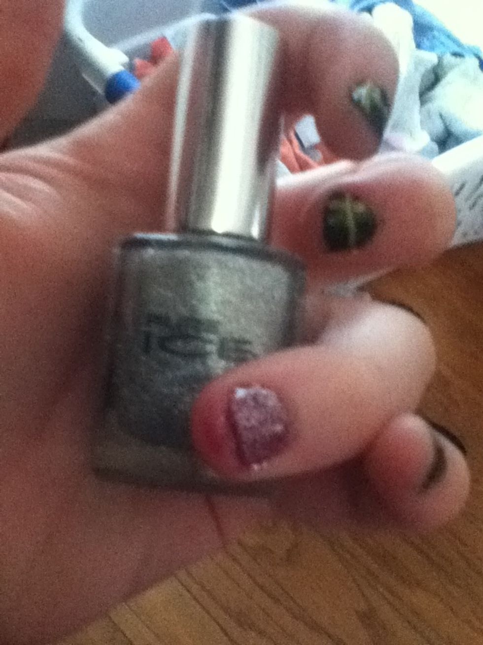 paint the silver glittery nail polish over the red nail.