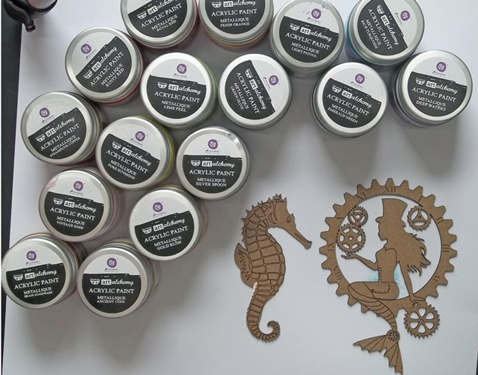 Paint the small Seahorse and Steampunk Mermaid using Metallique Acrylic Paints. I've used colours that coordinate with the colours in the Graphic 45 papers.