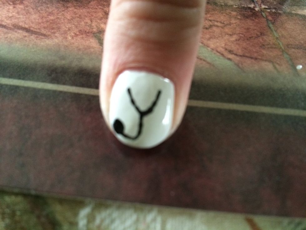 Paint the "tail" and bell of your stethoscope as shown in photo