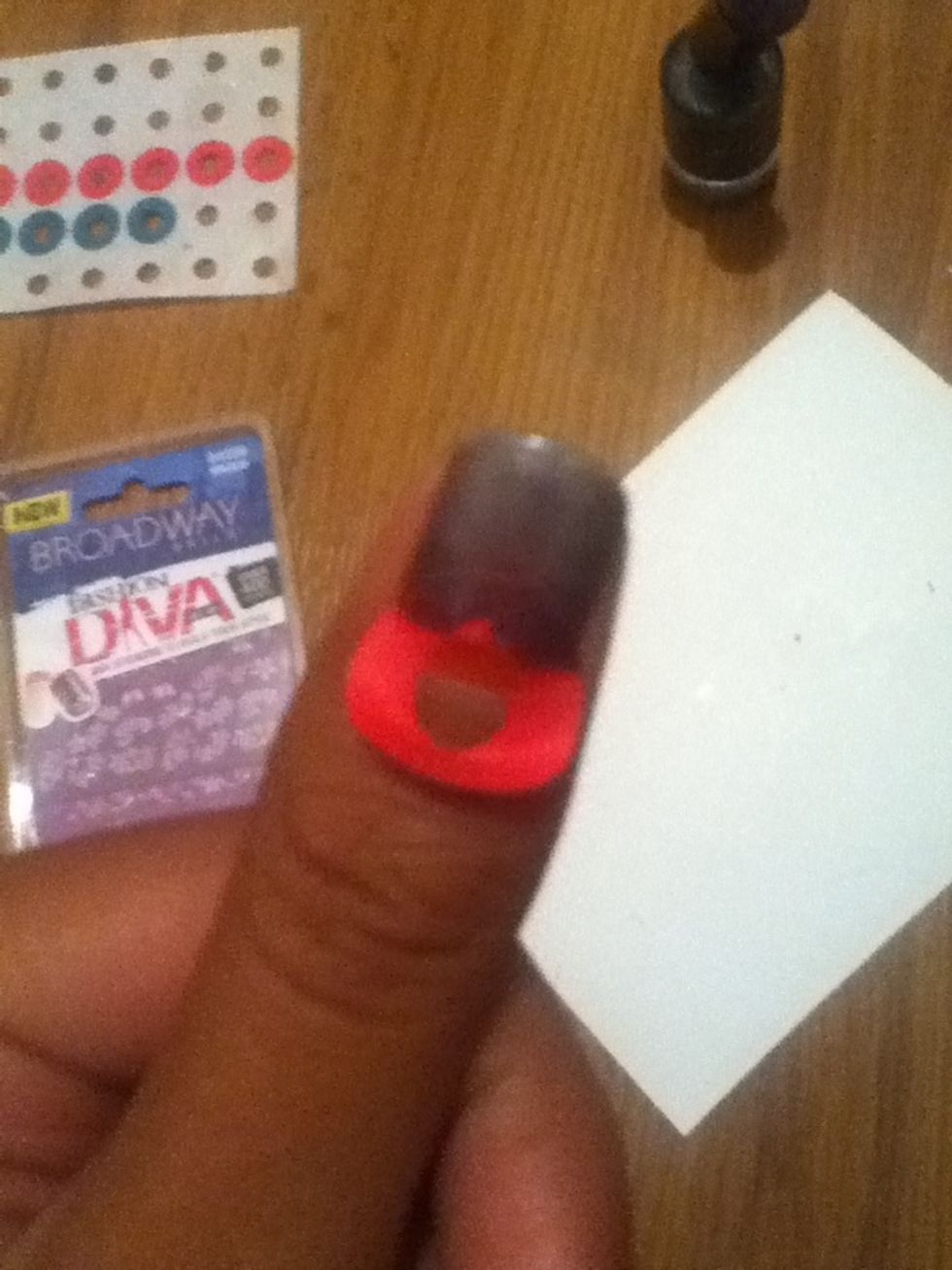 Paint the tip of your nail. Don't be afraid to paint over the sticker!
