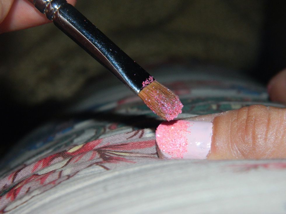 Paint the top half of your nails with clear polish and gently pat your nail with sparkles.
