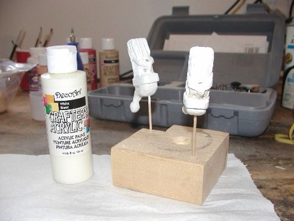 Paint the white first then follow up with the blue, red, and finally the flesh color.  I use a toothpick to color the eyes and mouth.