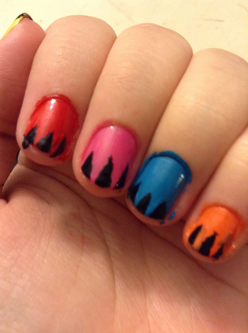 Paint three little black triangles on the tips of your nails.