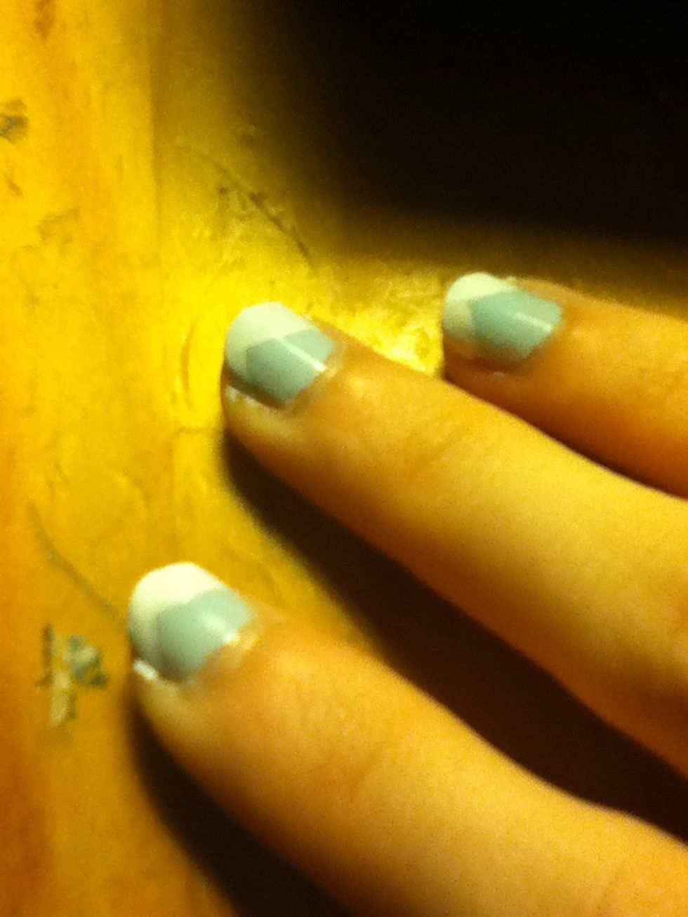 Paint white tips, coming to a point towards the left.