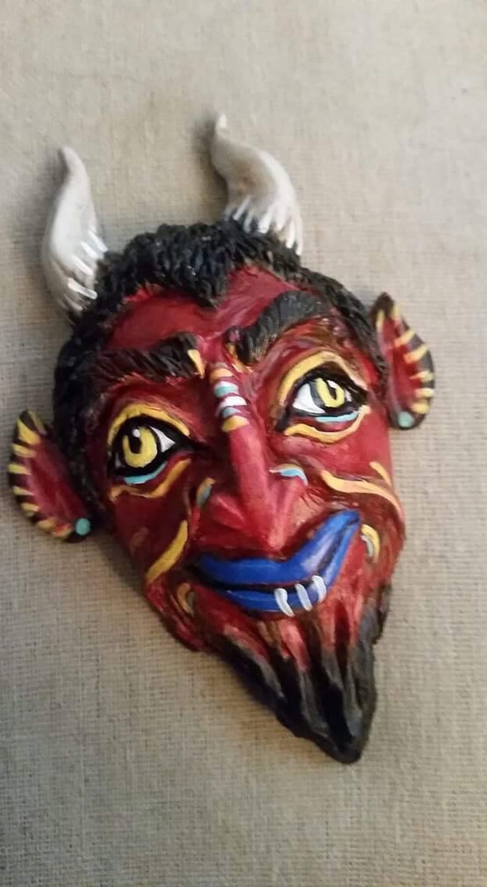 Paint with acrylic craft paint. While you wait on your piece to cure in between steps, add flames using Apoxie Sculpt to adhere them to a wood tray.