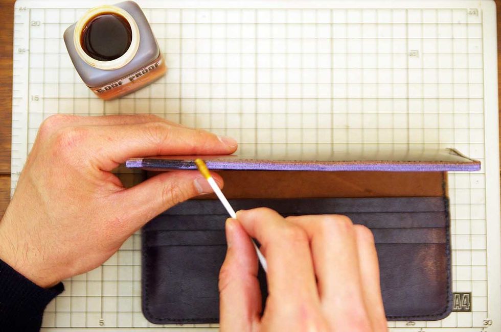 Paint with stain on the edge. This color is brown.