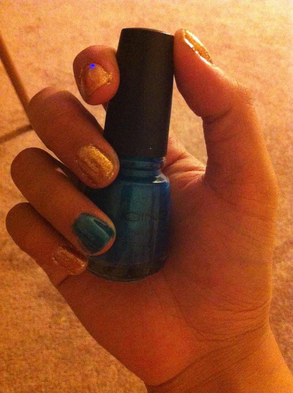 Paint your accent nail blue. Mine took 3 coats.