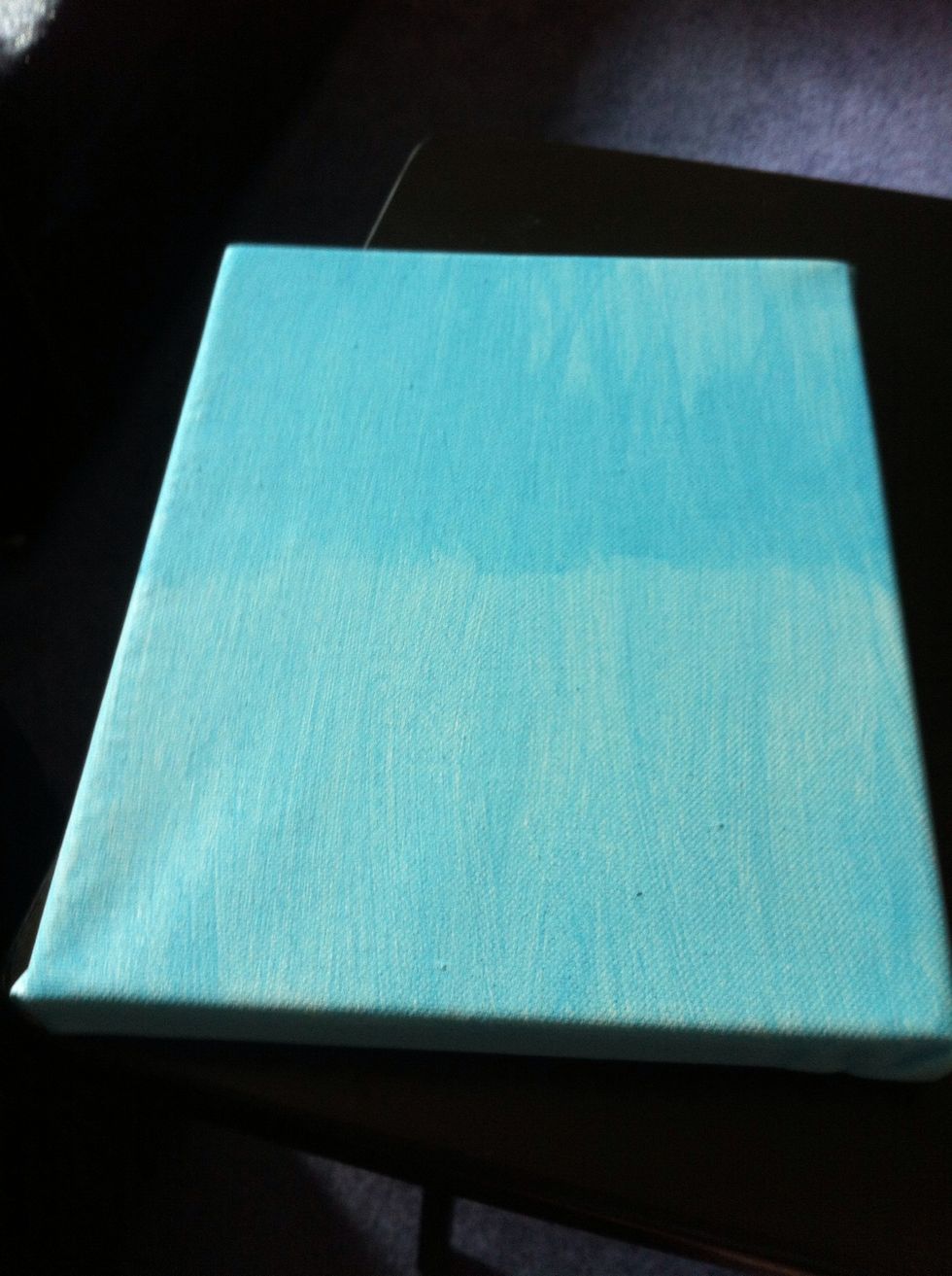 Paint your canvas a light blue color. Let dry