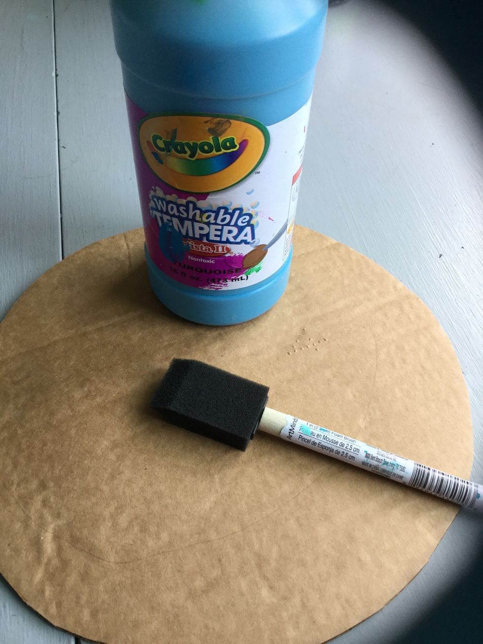 Paint your cardboard circle on the side with no lines. You may use a paintbrush or foam brush