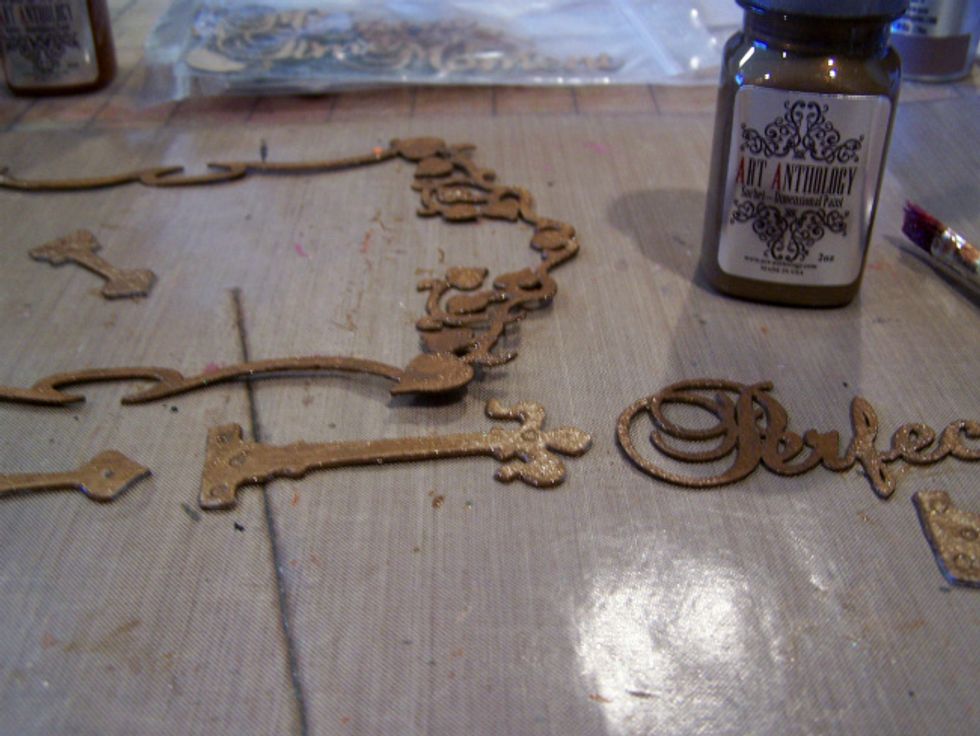 Paint your chipboard pieces with Sorbet Chocolate.
