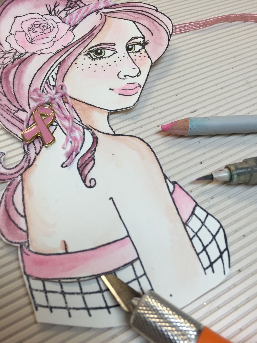 Paint your girl using Prima Watercolor pencils Make an incision on the line of the dress with an Xacto knife