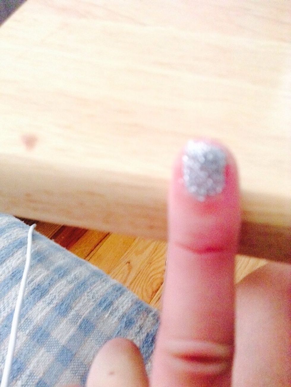 Paint your index finger with the fine silver glitter