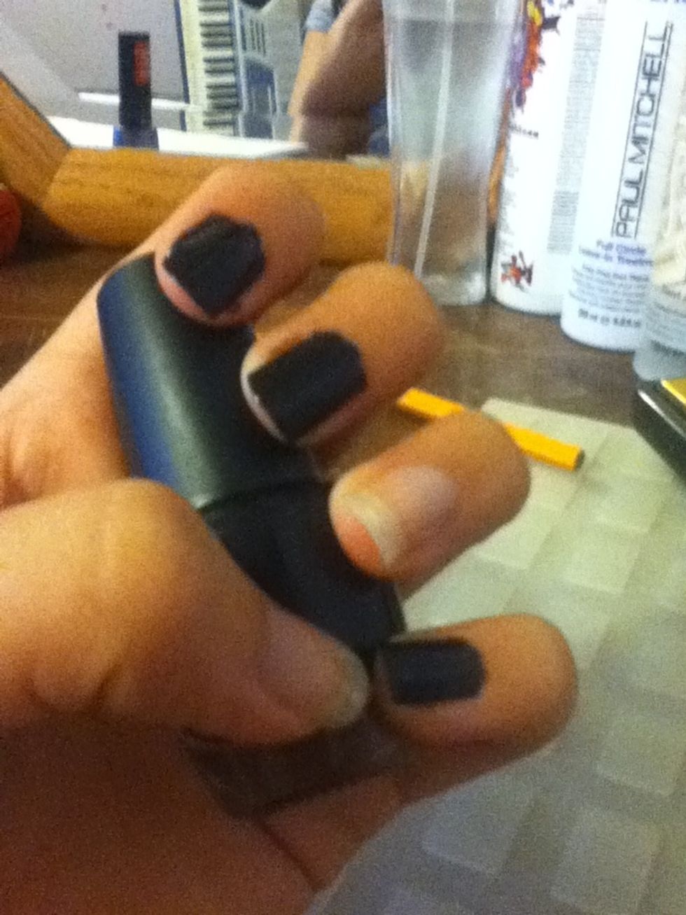 Paint your index, middle, and pinkie fingers two coats of the darker color of your two shades. I'm using black.